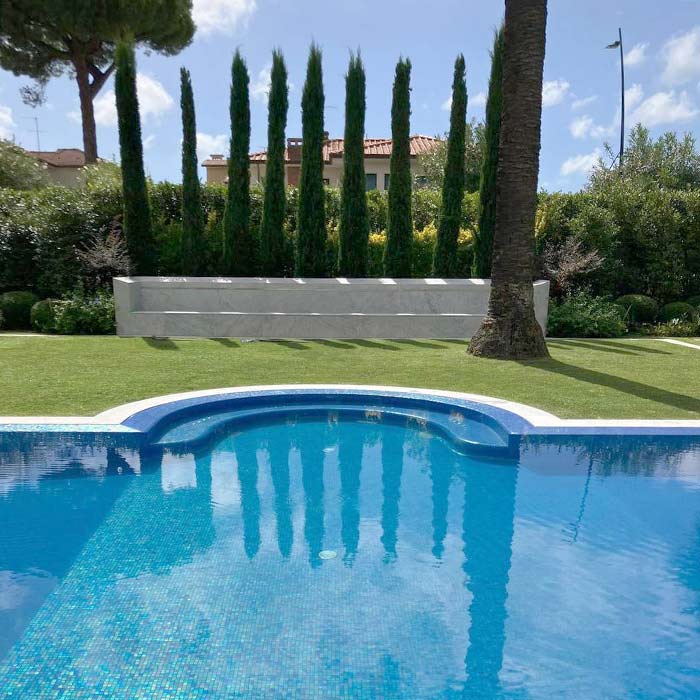 Residential swimming pool surrounded by a park
